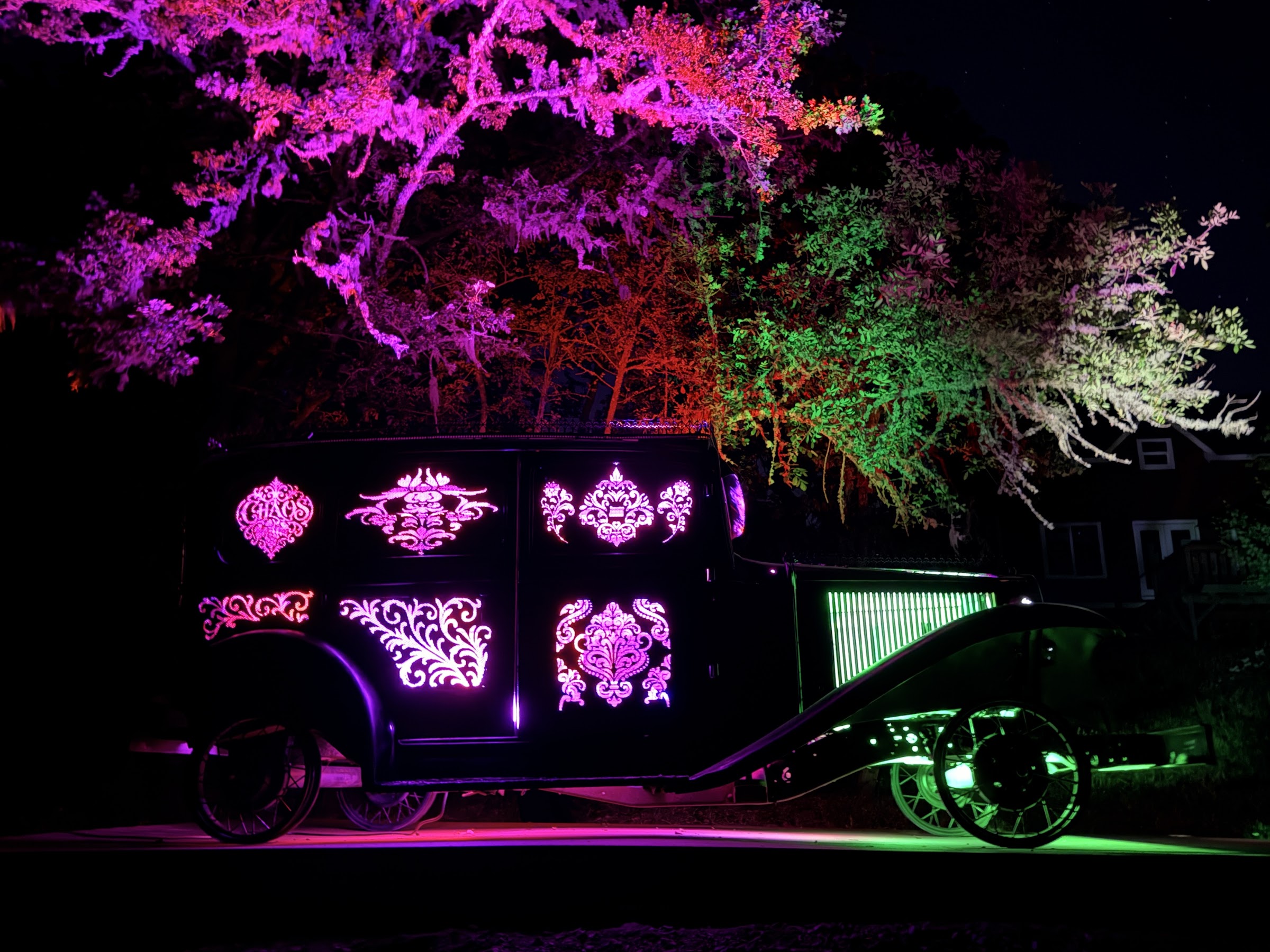 Ghost, illuminated art truck by Jud Turner, lit up at night at Chaos Vineyard